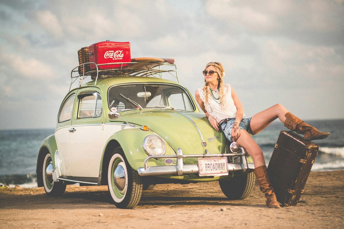 Woman with Vintage Beetle at the Beach
