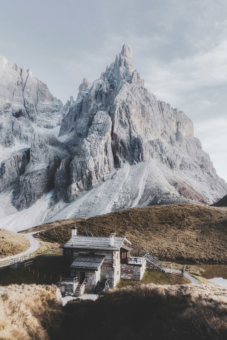 Alpine Cabin beneath Towering Peak