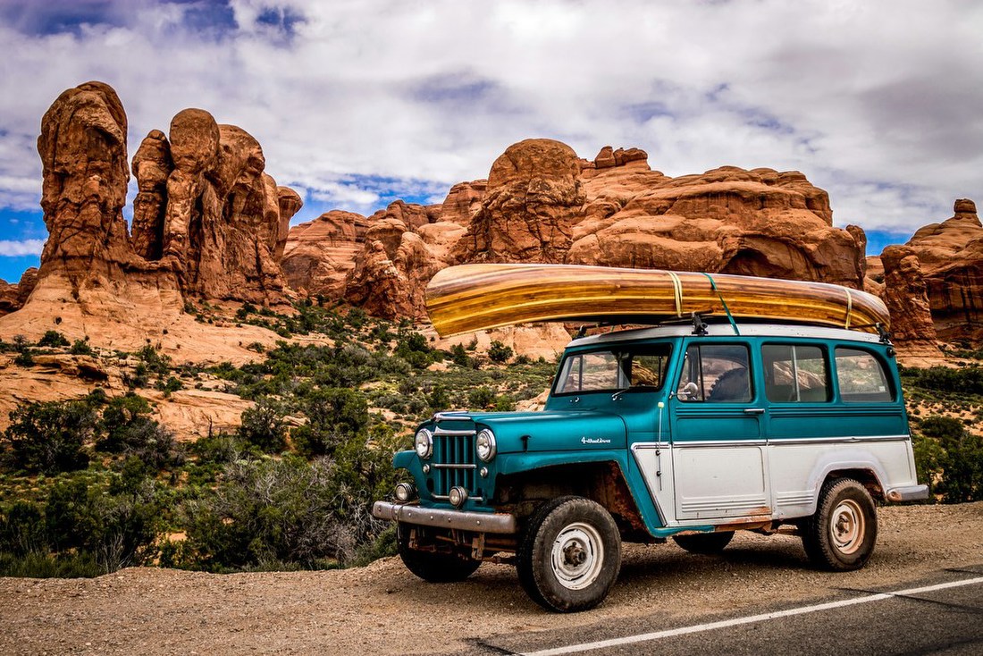 Vintage SUV in Desert Landscape