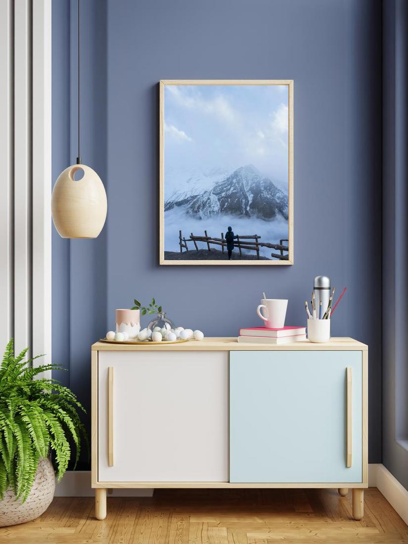 Figure Before Snowy Peaks