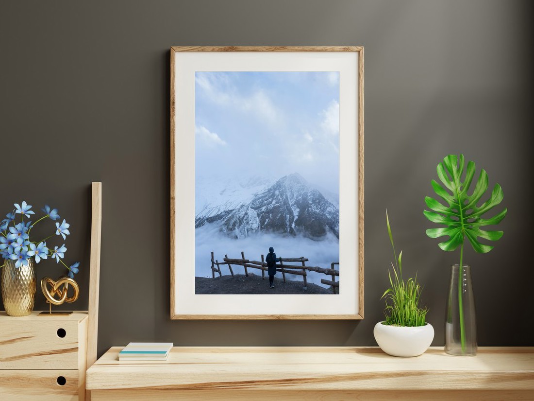 Figure Before Snowy Peaks