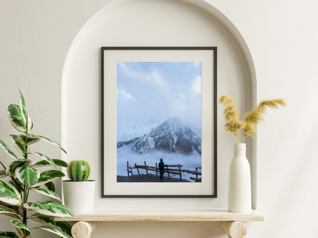 Figure Before Snowy Peaks