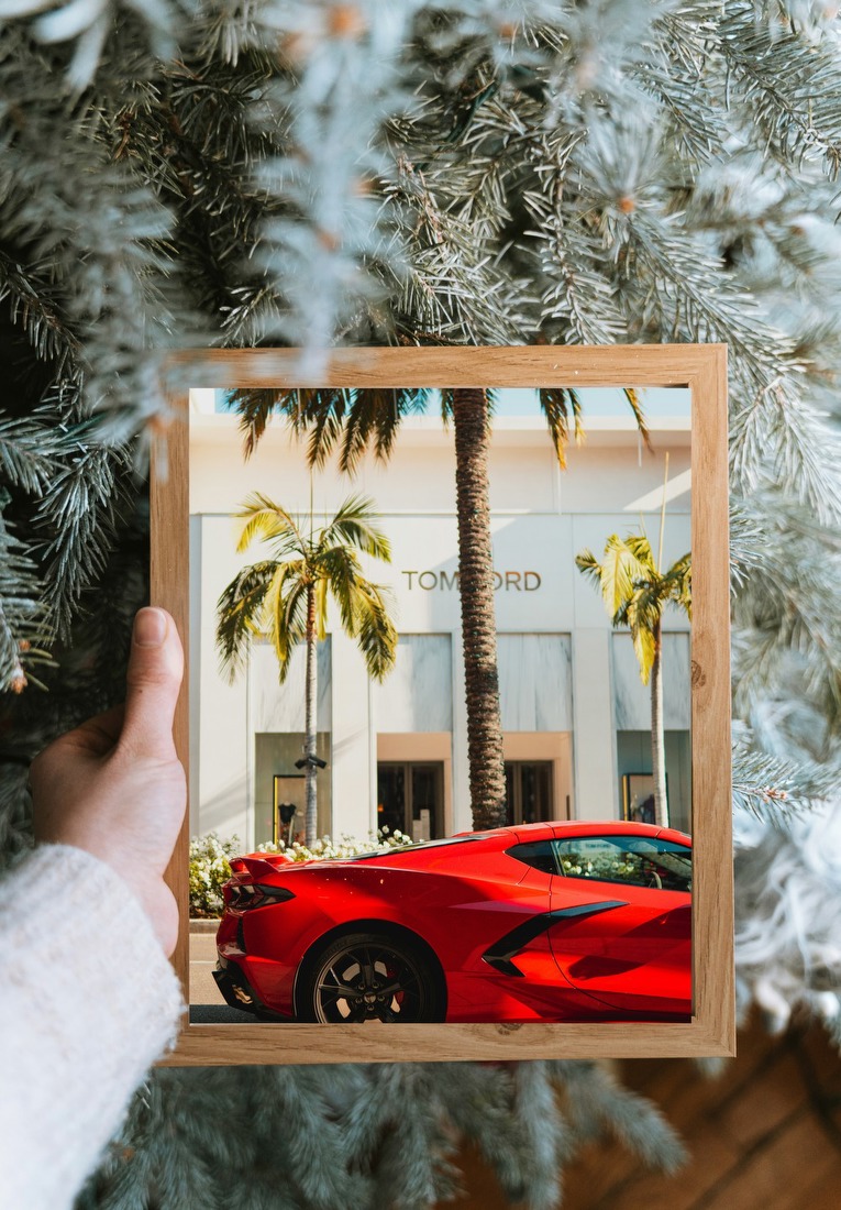 Red Sports Car on Palm-Lined Street