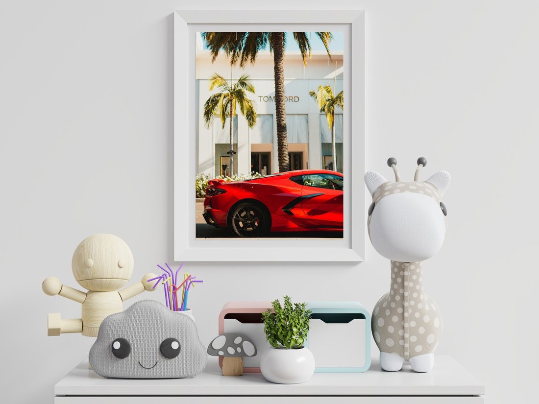 Red Sports Car on Palm-Lined Street