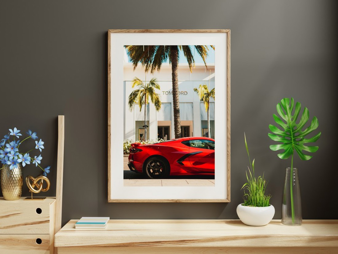 Red Sports Car on Palm-Lined Street