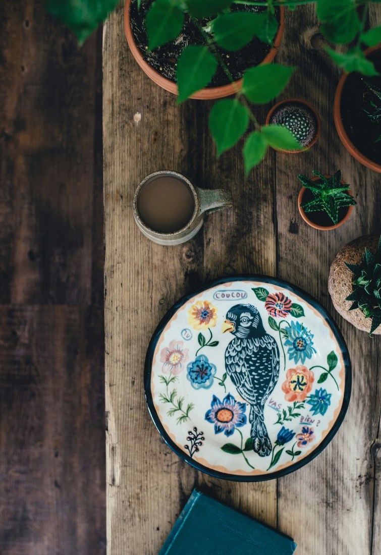 Decorative Bird Plate on Wooden Table