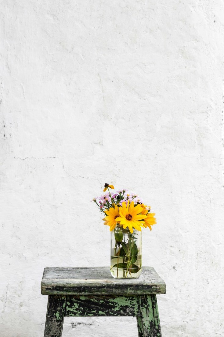 Sunlit Flowers on Stool